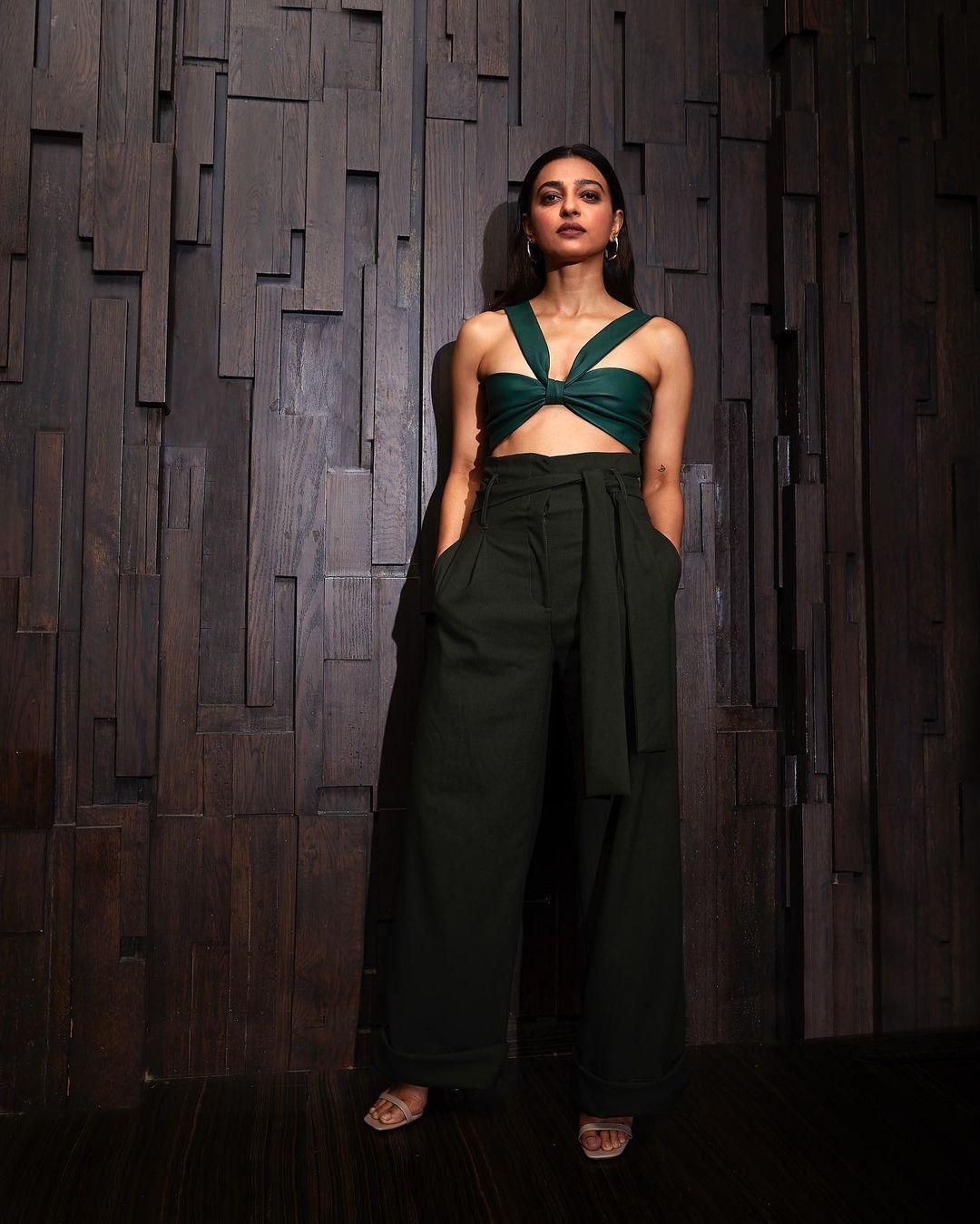 The wide-leg design elongates her legs with an easy, vintage charm. Accessorized with classic hoops, Radhika epitomizes modern chic while keeping her style relaxed and accessible.